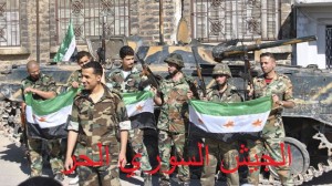 During the civil war, many of al-Assad's soldiers have defected and joined the rebel Free Syrian Army. These ex-Syrian Army soldiers are pictured holding an FSA flag.