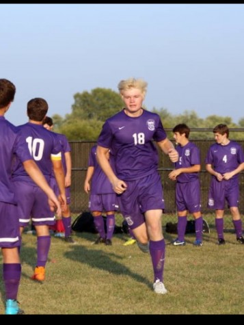 Mitch makes his way out to the pitch for his first Varsity Soccer match. 