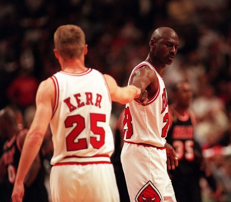Kerr and Jordan exchange fists in a friendly manor 