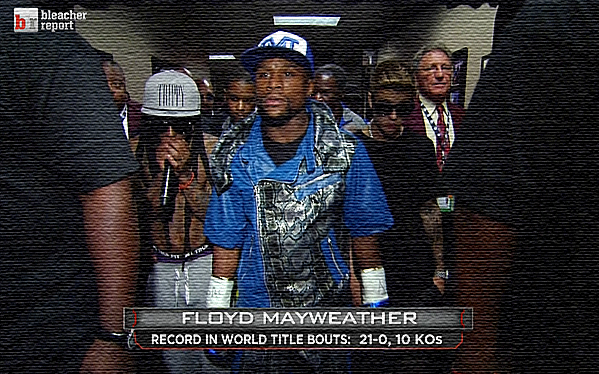 Floyd Mayweather walks out to the ring with Lil Wayne and Justin Bieber by his side