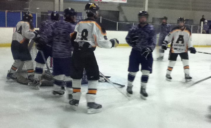 Elder varsity hockey salutes the U.S. Military vs. Alter