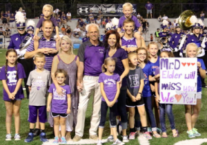 Coach Dabbelt and family being recognized by all of Elder Nation, during halftime of the 42-0 win against Pittsburgh University Prep