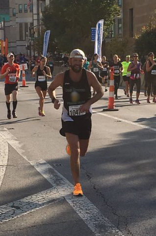 A hard finish from Coach Dickman during the Columbus Marathon.