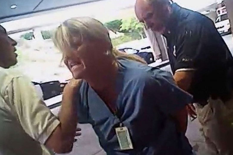 Nurse Wubbels being detained for following University Hospital procedure