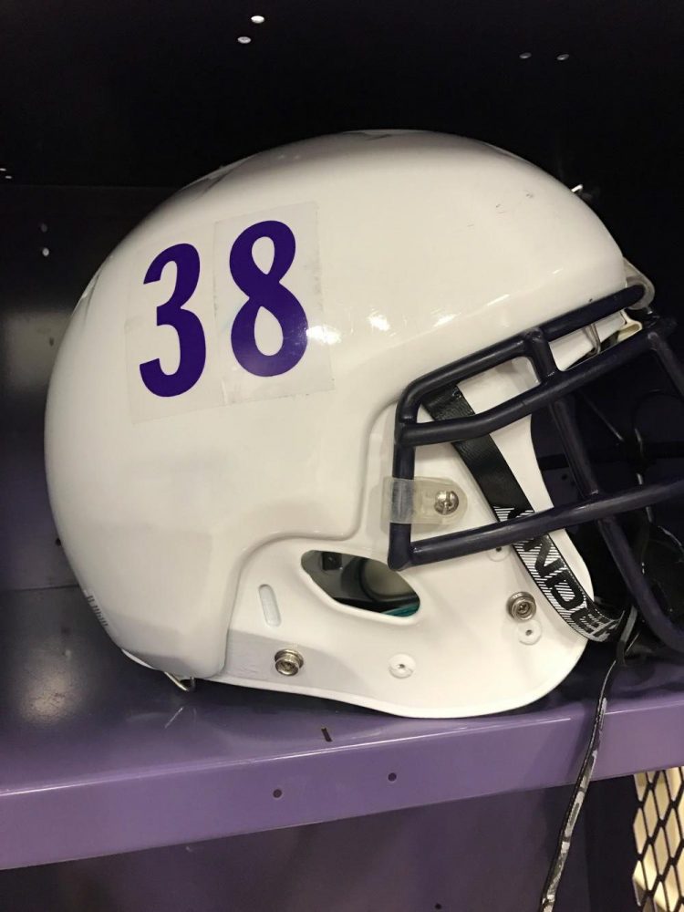 Senior Drew Shibinskis football helmet with the new Protech helmet cover on.