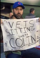 A veteran holding a sign in support for Colin Kaepernick