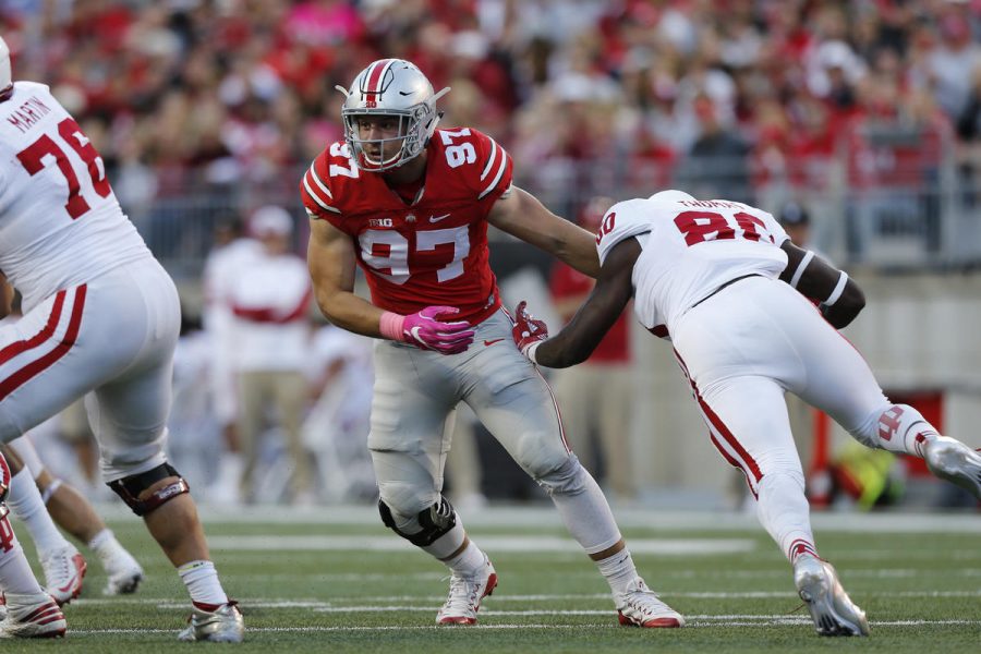 FILE - In this Oct. 8, 2016, file photo, Ohio State defensive end Nick Bosa plays against Indiana during an NCAA college football game, in Columbus, Ohio.  Bosa embraces his identity as the younger brother of former Buckeyes superstar Joey Bosa. Nick says he’s more comfortable this year and quicker off the line, and a new scheme that gives defensive ends more opportunities to make plays could allow him to start pursuing the sack numbers piled up by his sibling, now with the Chargers. (AP Photo/Jay LaPrete, File)