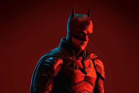 Robert Pattinsons Batman in red and black lighting, the theme of the movie via Mens Health