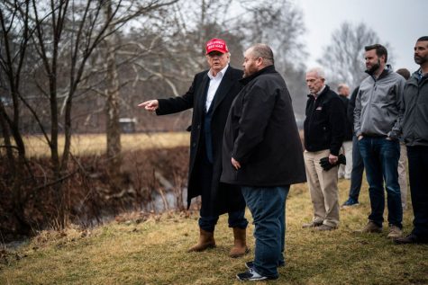 Washington , D.C.  - February 22 :  Former President Donald Trump looks at Little Beaver Creek and Water Pumps as he visits East Palestine, Ohio, following the Feb. 3 Norfolk Southern freight train derailment on Wednesday, Feb. 22, 2023, in East Palestine, Ohio. (Photo by Jabin Botsford/The Washington Post via Getty Images)