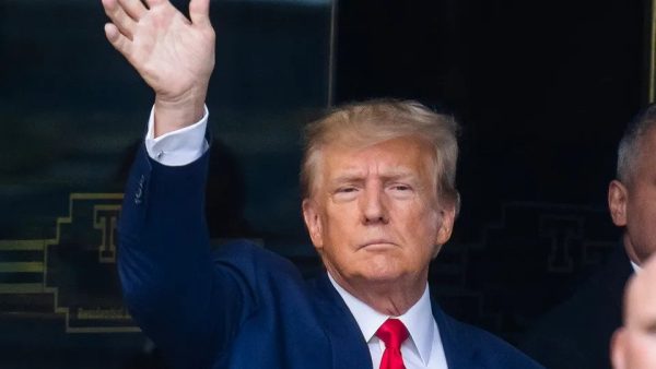Former President Trump waving to a crowd of supporters