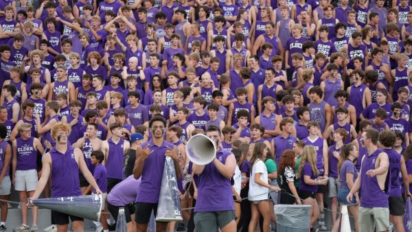 A sea of purple. Elder student section and cheerleaders.